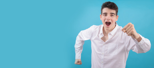 Wall Mural - portrait of teenager or male student isolated on color background