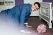 The groom is pressed from the floor. Happy man. Elegant  fiance in suit. Beautiful wedding bouquet