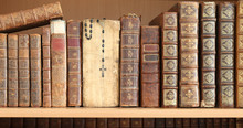 Antique Books On Old Wooden Shelf.