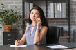 © Pixel-Shot - Beautiful young businesswoman talking by phone in office