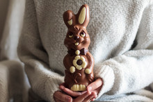 Woman Hands Holding Big Chocolate Easter Bunny