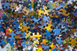 Pile of colourful jigsaw puzzle pieces
