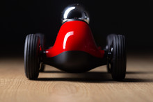 Red Toy Vintage Retro Racing Car Detail On A Hardwood Surface