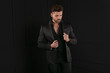 © neonshot - Man in elegant black suit posing