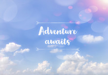 Adventure Awaits Word On Blue Cloudy Sky Background
