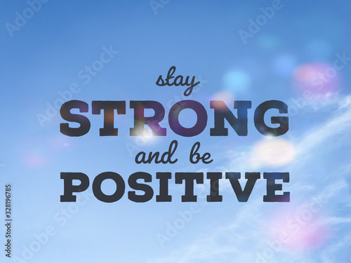Cuadros en Lienzo Stay strong and be positive word on blue sky colorful bokeh background