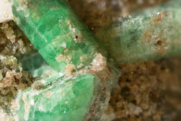 Wall Mural - Green crystal emerald in macro view.
