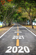 © smshoot - Tree tunnel with 2020 to 2026 on asphalt road surface, happy new year concept and natural idea
