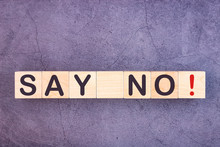 SAY NO Word Written On Wood Block On A Grey Background