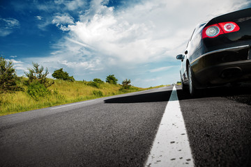 Wall Mural - black car on asphalt road