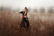 happy shorthaired pointer dog running outdoors in a tracking collar