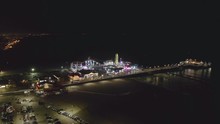 Aerial, Tracking, Drone Shot Around The Santa Monica Pier, At Night Time, In Los Angeles, USA