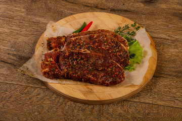 Raw marinated pork steak