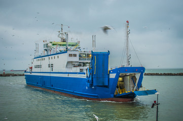 Crimea, kerch ferry swimming with cars and tourists on rainy weather.