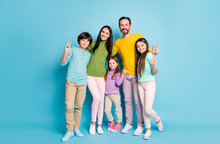 Full Length Body Size View Of Nice Attractive Lovely Glad Cheerful Cheery Family Pre-teen Kids Embracing Showing V-sign Having Fun Isolated On Bright Vivid Shine Vibrant Blue Color Background