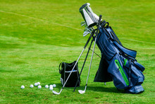 Bag Of Golf Clubs On The Golf Course.