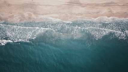 Wall Mural - Aerial drone footage above beautiful sea and waves