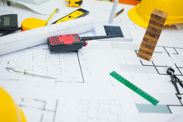 Close-up of an architect's desk with blueprints.