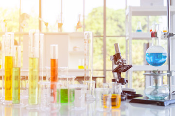 Poster - Chemical reagent bottles, scientific experiment bottles of various shapes, sizes and microscopes on the table