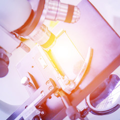 Poster - Close-up of microscope and orange light