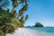 © Igor Tichonow - Philippines, Palawan, El Nido beach at low tide, palm tree and amazing Pinagbuyutan island in background. Exotic vacation holiday travel concept