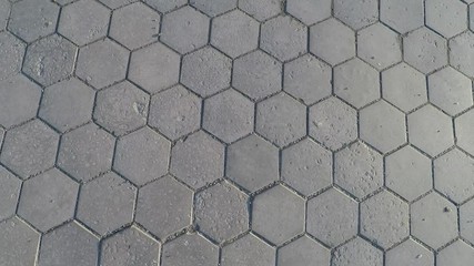 Wall Mural - Texture of old paving tile hexagonal form of gray color