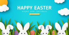 Easter Card With White Bunny Rabbits, Colorful Eggs And Green Grass. Blue Sky Background With Sun And Clouds In Paper Cut Style. Vector Illustration. Place For Your Text.