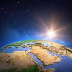 Wall Mural - sun shining over middle east from space. gulf region map.