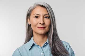 Wall Mural - Image of adult mature woman with long white hair looking at camera