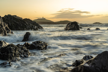 Ballycotton Lighthouse at sunrise, beautiful landscape and one of only two black lighthouses in Ireland.