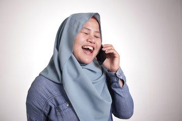 Wall Mural - Muslim Lady Talking on Phone, Smiling Expression