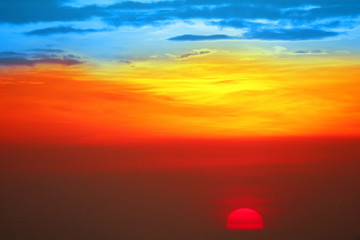 Wall Mural - blue orange yellow red silhouette sky in sunset back on the cloud