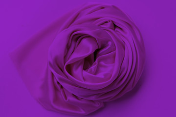 Wall Mural - lilac beautiful satin draped with soft folds fabric, silk cloth background, close-up, copy space