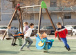 © JackF - Children are teetering on the swing in the playground