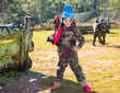 © JackF - Boy paintball player in camouflage standing with gun before playing outdoors