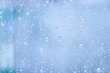 Fototapeta Dmuchawce - Rain drops on the glass. Wet window_