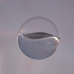 Wall Mural - sea wave in a glass sphere