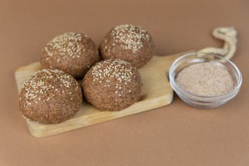 Keto bread made from almond flour and psyllium on craft paper background. Paleo and intermittent fasting diet.