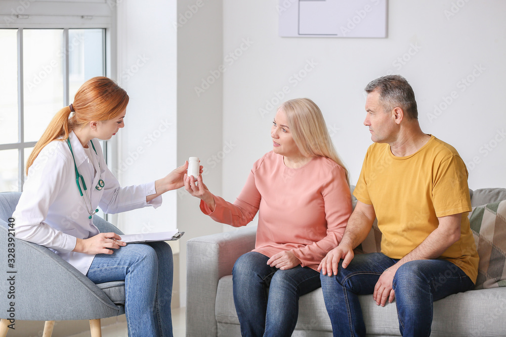 Mature couple visiting doctor in clinic