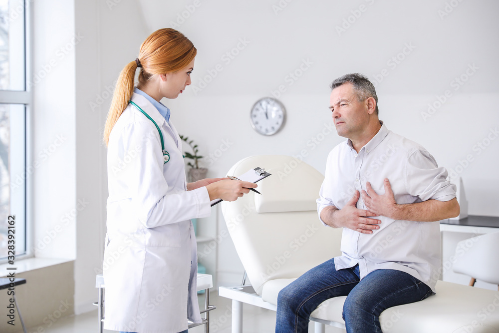 Mature man visiting doctor in clinic