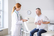 © Pixel-Shot - Mature man visiting doctor in clinic