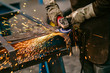 © kerkezz - Factory worker grinding a metal,close up