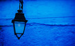 © Michael Marquand - old street lamp on the wall, Chefchaouen, Morocco