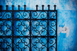 © Michael Marquand - Metal gate against a blue wall in the medina of Rabat, Morocco