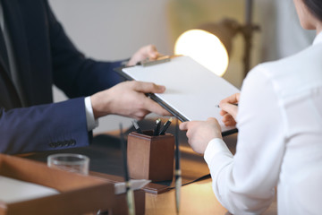 Wall Mural - Male lawyer working with client in office, closeup