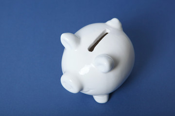 Wall Mural - piggy piggy bank on a colored background. The concept of saving money.