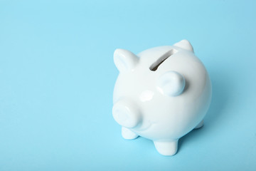 Wall Mural - piggy piggy bank on a colored background. The concept of saving money.