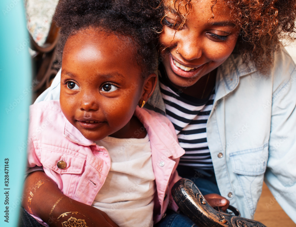 adorable sweet young afro-american mother with cute little daughter, hanging at home, having fun playing smiling, lifestyle people concept, queen girl - obrazy, fototapety, plakaty 