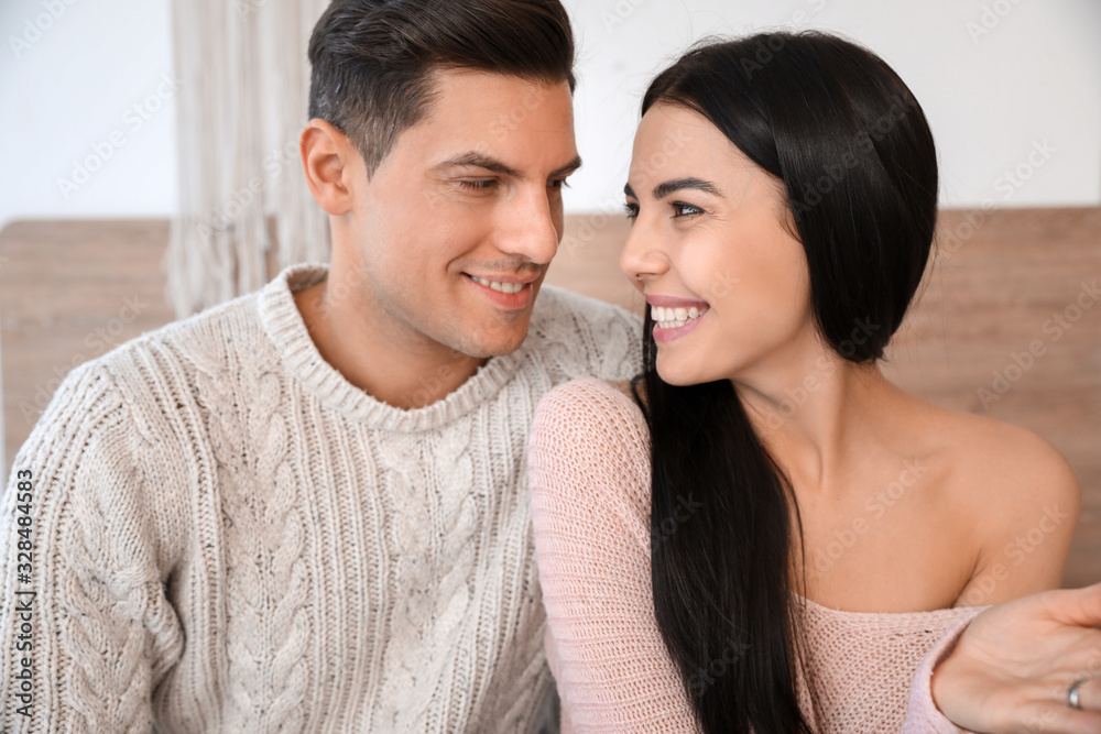 Young couple video chatting at home