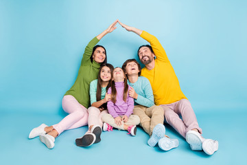 Sticker - Portrait of nice attractive careful friendly excited cheerful cheery big full family sitting parents making roof enjoy new life dream flat isolated on bright vivid shine vibrant blue color background